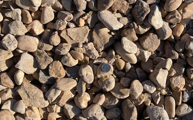 Hill Country River Rock — Rock & Gravel material delivered and installed by Canopy Land Solutions in San Antonio, TX