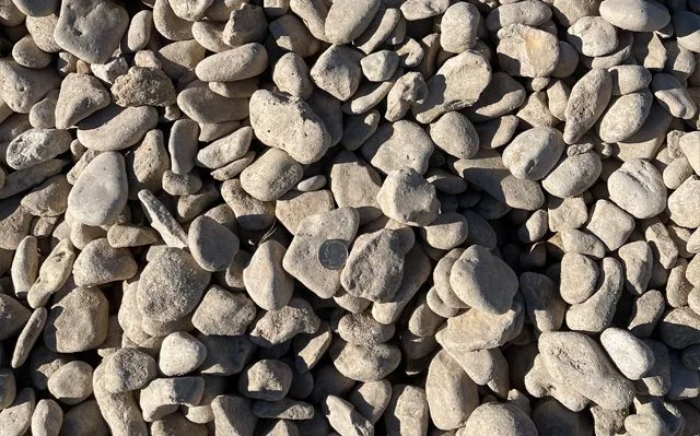 Medina River Rock — Rock & Gravel material delivered and installed by Canopy Land Solutions in San Antonio, TX